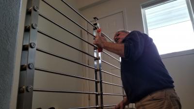 5.4 Double check each post for plumb, making minor adjustments as necessary before locking down railing.